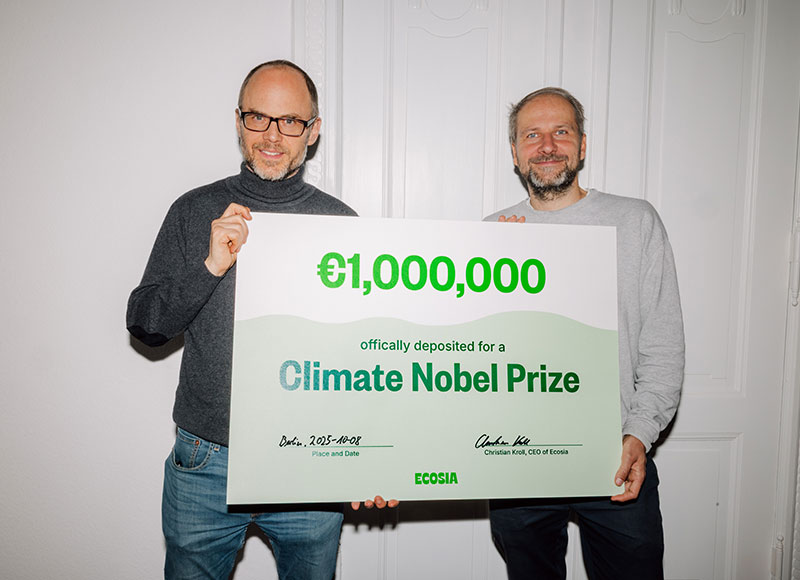 Ecosia CEO Christian Kroll holding a €1,000,000 cheque for the Climate Nobel Prize